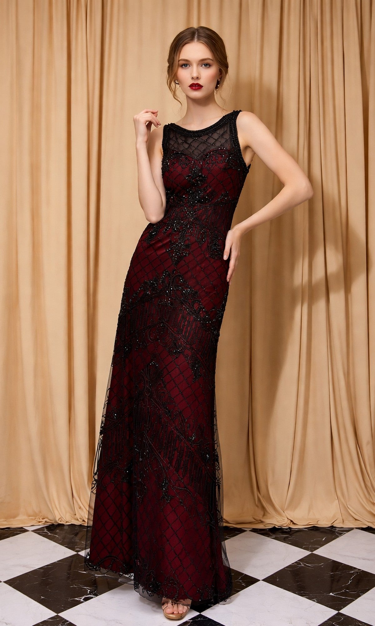 A woman wears the Long Formal Dress: Eureka 3915 in black/red, featuring a sleeveless, floor-length design with beaded details and an illusion neckline, standing before gold curtains on a black and white checkered floor.